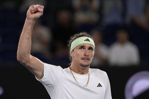 Alexander Zverev of Germany reacts after winning a point against Carlos Alcaraz of Spain during their quarterfinal match at the Australian Open tennis championships at Melbourne Park, Melbourne, Australia, Thursday, Jan. 25, 2024. (AP Photo/Alessandra Tarantino)