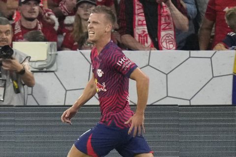 Leipzig's Dani Olmo celebrates after scoring his sides third goal during the German Super Cup final between FC Bayern Munich and RB Leipzig at the Allianz Arena stadium in Munich, Germany, Saturday, Aug. 12, 2023. (AP Photo/Matthias Schrader)