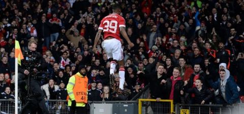Manchester United's English striker Marcus Rashford celebrates scoring his team's second goal during the UEFA Europa League round of 32, second leg football match between Manchester United and and FC Midtjylland at Old Trafford in Manchester, north west England, on February 25, 2016. . / AFP / OLI SCARFF        (Photo credit should read OLI SCARFF/AFP/Getty Images)