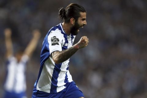 Porto's Sergio Oliveira celebrates after scoring the opening goal during the Portuguese league soccer match between FC Porto and Feirense at the Dragao stadium in Porto, Portugal, Sunday, May 6, 2018. Porto clinched the league title Saturday night, two rounds before the end, when Benfica and Sporting CP tied 0-0 in their Lisbon derby. (AP Photo/Luis Vieira)