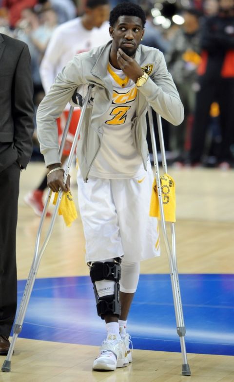 Virginia Commonwealth guard Briante Weber stands on the court with crutches before an NCAA college basketball second round game against Ohio State in Portland, Ore., Thursday, March 19, 2015.   Weber is out with a right knee injury. (AP Photo/Greg Wahl-Stephens)