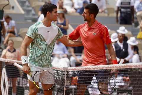 Spain's Carlos Alcaraz, left, and Serbia's Novak Djokovic greet each other ahead of their semifinal match of the French Open tennis tournament at the Roland Garros stadium in Paris, Friday, June 9, 2023. (AP Photo/Jean-Francois Badias)