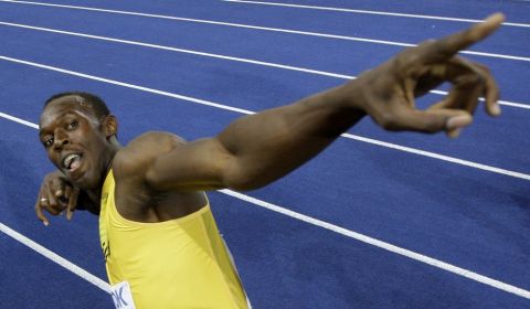 Jamaica's Usain Bolt celebrates setting a new 100m World Record after the final of the Men's 100m during the World Athletics Championships in Berlin on Sunday, Aug. 16, 2009. (AP Photo/David J. Phillip)