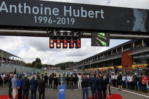 A moment of silence takes place for Formula 2 driver Anthoine Hubert prior to the start of the Belgian Formula One Grand Prix in Spa-Francorchamps, Belgium, Sunday, Sept. 1, 2019. The 22-year-old Hubert died Saturday following an estimated 160 mph (257 kph) collision on Lap 2 at the high-speed Spa-Francorchamps track, which earlier Saturday saw qualifying for Sunday's Formula One race.(Valdrin Xhemaj, Pool Photo via AP)