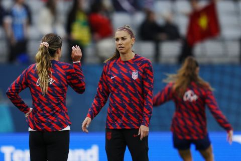 United States' Alex Morgan, center, warms up before the Women's World Cup Group E soccer match between the United States and Vietnam at Eden Park in Auckland, New Zealand, Saturday, July 22, 2023. (AP Photo/Abbie Parr)