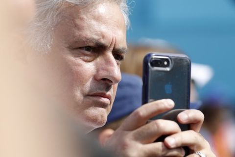 Portuguese soccer coach Jose Mourinho watches the men's singles semifinal match between Felix Auger-Aliassime of Canada and Feliciano Lopez of Spain at the Queens Club tennis tournament in London, Saturday, June 22, 2019. (AP Photo/Alastair Grant)