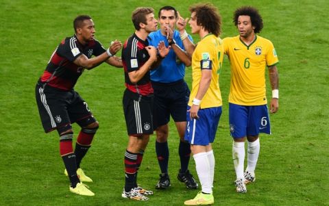 BELO HORIZONTE, BRAZIL - JULY 08:  Referee Marco Rodriguez separates a clash between Jerome Boateng and Thomas Mueller of Germany and David Luiz and Marcelo of Brazil during the 2014 FIFA World Cup Brazil Semi Final match between Brazil and Germany at Estadio Mineirao on July 8, 2014 in Belo Horizonte, Brazil.  (Photo by Jamie McDonald/Getty Images)