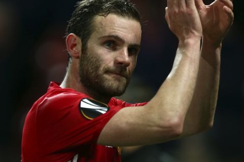 United's Juan Mata applauds at the end of the Europa League round of 16, second leg, soccer match between Manchester United and FC Rostov at Old Trafford Stadium in Manchester, England, Thursday March 16, 2017. Mata scored the goal in United's 1-0 win. (AP Photo/Dave Thompson)