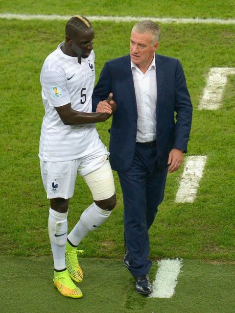 RIO DE JANEIRO, BRAZIL - JUNE 25: Mamadou Sakho of France shakes hands with head coach Didier Deschamps during the 2014 FIFA World Cup Brazil Group E match between Ecuador and France at Maracana on June 25, 2014 in Rio de Janeiro, Brazil.  (Photo by Alexandre Loureiro/Getty Images)