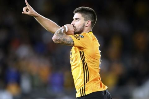 Wolverhampton Wanderers' Ruben Neves celebrates after scoring his side's opening goal during the English Premier League soccer match between Wolverhampton Wanderers and Manchester United at the Molineux Stadium in Wolverhampton, England, Monday, Aug. 19, 2019. (Nick Potts/PA via AP)
