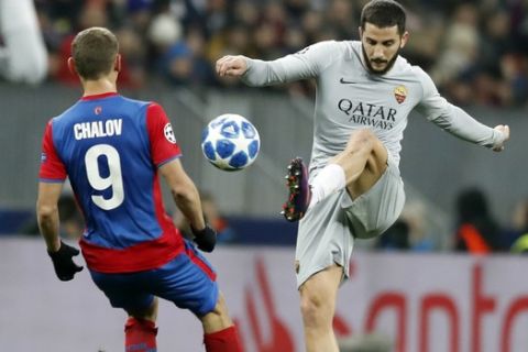 Roma defender Kostas Manolas, right, challenges for the ball with CSKA forward Fedor Chalov during a Group G Champions League soccer match between CSKA Moscow and Roma at the Luzhniki Stadium in Moscow, Wednesday, Nov. 7, 2018. (AP Photo/Pavel Golovkin)
