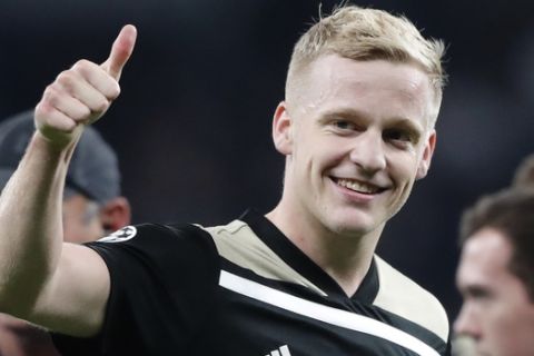 Ajax's Donny van de Beek, who scored his side's only goal, flashes a thumbs up after winning the Champions League semifinal first leg soccer match between Tottenham Hotspur and Ajax with a 1-0 score at the Tottenham Hotspur stadium in London, Tuesday, April 30, 2019. (AP Photo/Frank Augstein)