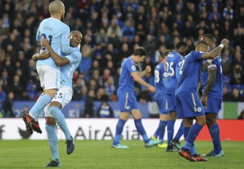 Manchester City's David Silva, left, celebrates with Manchester City's Fernandinho after Manchester City's Gabriel Jesus scored during the English Premier League soccer match between Leicester City and Manchester City at the King Power Stadium in Leicester, England, Saturday, Nov. 18, 2017. (AP Photo/Rui Vieira)