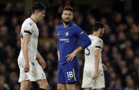Chelsea's Olivier Giroud, center, reacts after missing a chance to score during the English Premier League soccer match between Chelsea and Crystal Palace at Stamford Bridge stadium in London, Saturday, March 10, 2018. (AP Photo/Matt Dunham)