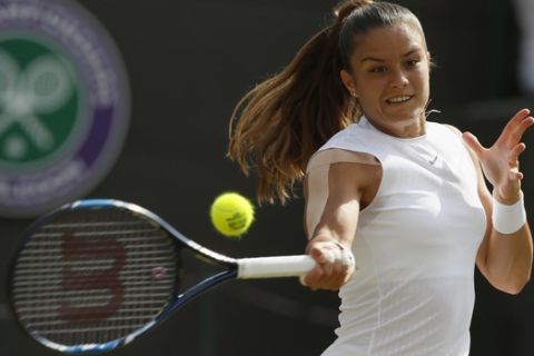 Greece's Maria Sakkari returns to Britain's Johanna Konta during their Women's Singles Match on day five at the Wimbledon Tennis Championships in London Friday, July 7, 2017. (AP Photo/Kirsty Wigglesworth)