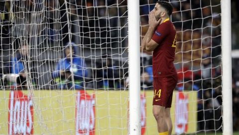 Roma's Kostas Manolas reacts after missing a scoring chance during a Champions League, Group G soccer match between Roma and Real Madrid at the Rome Olympic stadium, Tuesday, Nov. 27, 2018. (AP Photo/Gregorio Borgia)