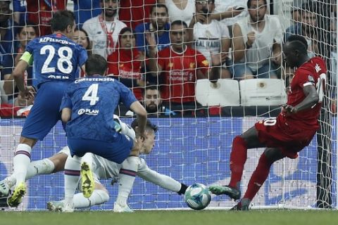 Liverpool's Sadio Mane, right, scores his side's first goal during the UEFA Super Cup soccer match between Liverpool and Chelsea, in Besiktas Park, in Istanbul, Wednesday, Aug. 14, 2019.(AP Photo/Lefteris Pitarakis)