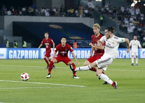 Real Madrid's midfielder Gareth Bale, right, scores his side's opening goal during the Club World Cup semifinal soccer match between Real Madrid and Kashima Antlers at Zayed Sports City stadium in Abu Dhabi, United Arab Emirates, Wednesday, Dec. 19, 2018. (AP Photo/Hassan Ammar)