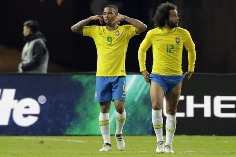 Brazil's Gabriel Jesus, left, celebrates after scoring the opening goal during the international friendly soccer match between Germany and Brazil in Berlin, Germany, Tuesday, March 27, 2018. (AP Photo/Markus Schreiber)