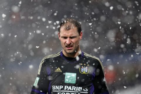Anderlecht's Milan Jovanovic stands in the snow during the Jupiler Pro League match between RSC Anderlecht and Sporting Lokeren, on December 18, 2011 in Brussels, the 18th day of the Belgian football championship. AFP PHOTO /  BELGA PHOTO VIRGINIE LEFOUR (Photo credit should read VIRGINIE LEFOUR/AFP/Getty Images)