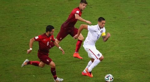 MANAUS, BRAZIL - JUNE 22: Clint Dempsey of the United States controls the ball against Joao Moutinho of Portugal during the 2014 FIFA World Cup Brazil Group G match between the United States and Portugal at Arena Amazonia on June 22, 2014 in Manaus, Brazil.  (Photo by Elsa/Getty Images)