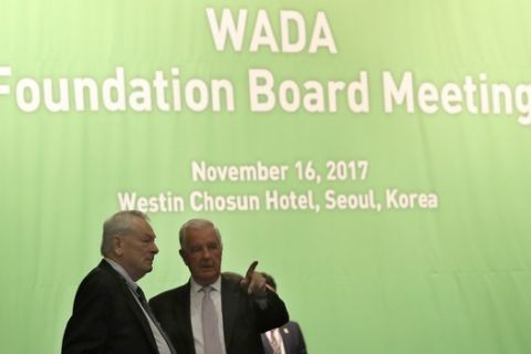 World Anti-Doping Agency (WADA) President Craig Reedie, right, talks with IOC member Richard Pound from Canada before the start of the WADA's foundation board meeting in Seoul, South Korea, Thursday, Nov. 16, 2017. The WADA holds its executive committee and foundation board meeting for three days in the country which will host the 2018 Olympic and Paralympic Winter Games held in February 2018. (AP Photo/Lee Jin-man)