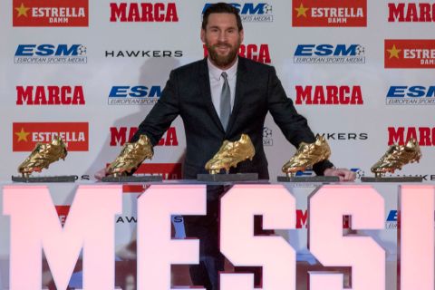 FC Barcelona's Lionel Messi from Argentina poses for the media after receiving his 5th Golden Boot award, in Barcelona, Spain, Tuesday, Dec.18, 2018. (AP Photo/Joan Monfort)