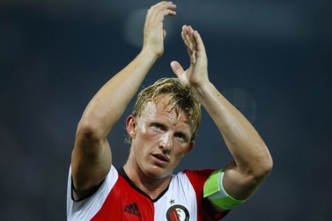 In this Sept. 15m 2016 file photo Feyenoord's team captain Dirk Kuyt applauds the supporters at the end of the Group A Europa League match between Feyenoord and Manchester United at the De Kuip stadium in Rotterdam, Netherlands. Veteran captain Dirk Kuyt scored a hat trick Sunday May 14, 2017, as Feyenoord beat Heracles Almelo 3-1 to win its 15th Dutch Eredivisie title and the first in 18 long years for its fervent fans. Kuyt returned to Feyenoord in the twilight of his career saying he wanted to lead the team to the Dutch championship and scored his 100th goal for the club in the first minute to settle nerves throughout Rotterdam. (AP Photo/Peter Dejong)