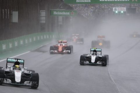 Mercedes driver Lewis Hamilton, of Britain, leads followed by teammate Nico Rosberg after the start of the Brazilian Formula One Grand Prix at the Interlagos race track in Sao Paulo, Brazil, Sunday, Nov. 13, 2016. (AP Photo/Andre Penner)