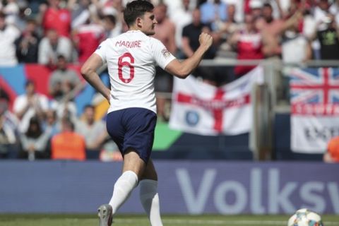 England's Harry Maguire reacts after scoring the penalty in a shootout at the end the UEFA Nations League third place soccer match between Switzerland and England at the D. Afonso Henriques stadium in Guimaraes, Portugal, Sunday, June 9, 2019. (AP Photo/Luis Vieira)