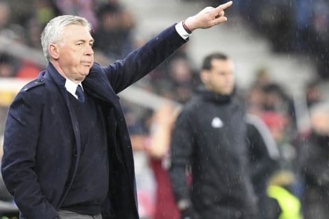 Napoli coach Carlo Ancelotti gives directions to the players during the Europa League round of 16 second leg soccer match between FC Salzburg and Napoli in the Arena stadium in Salzburg, Austria, Thursday, March 14, 2019. (AP Photo/Kerstin Joensson)