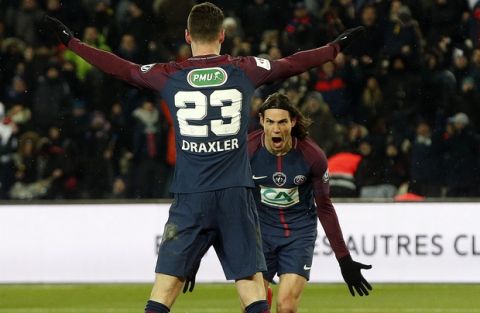 PSG's Edinson Cavani, right, celebrates with teammate Julian Draxler after scoring his side's third goal during the French Cup soccer match between Paris Saint-Germain and Marseille at the Parc des Princes Stadium, in Paris, France, Wednesday, Feb. 28, 2018. (AP Photo/Thibault Camus)