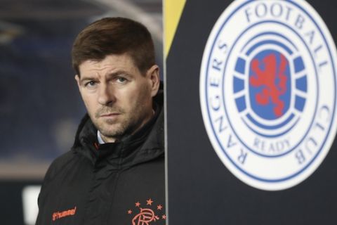 Rangers' manager Steven Gerrard stands prior to the start of the Europa League group G soccer match between Rangers and Young Boys at the Ibrox stadium in Glasgow, Scotland, Thursday, Dec. 12, 2019. (AP Photo/Scott Heppell)