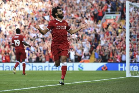 Liverpool's Mohamed Salah celebrates scoring his side's third goal of the game during their English Premier League soccer match at Anfield, Liverpool, England, Sunday Aug. 27, 2017. (Peter Byrne/PA via AP)