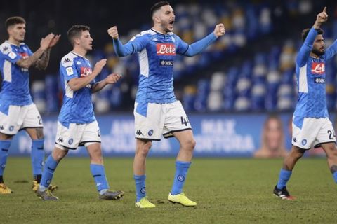 Napoli's Konstantinos Manolas, center, and his teammates celebrate the victory over Lazio during their Italian Cup Serie A quarterfinal soccer match at San Paolo stadium in Napoli, Italy, Tuesday, Jan. 21, 2020. (LaPresse via AP)
