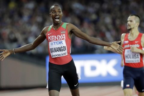 Kenya's Elijah Motonei Manangoi celebrates winning the gold medal in the Men's 1500m final during the World Athletics Championships in London Sunday, Aug. 13, 2017. (AP Photo/David J. Phillip)