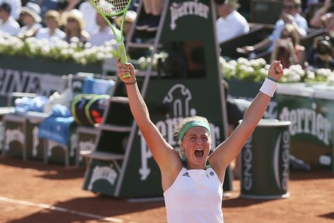 Latvia's Jelena Ostapenko celebrates her win over Timea Bacsinszky of Switzerland during their semifinal match of the French Open tennis tournament at the Roland Garros stadium, Thursday, June 8, 2017 in Paris. (AP Photo/David Vincent)
