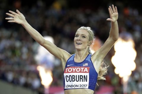 United States' Emma Coburn celebrates after winning the gold medal in the women's 3000m steeplechase final during the World Athletics Championships in London Friday, Aug. 11, 2017. (AP Photo/Matthias Schrader)