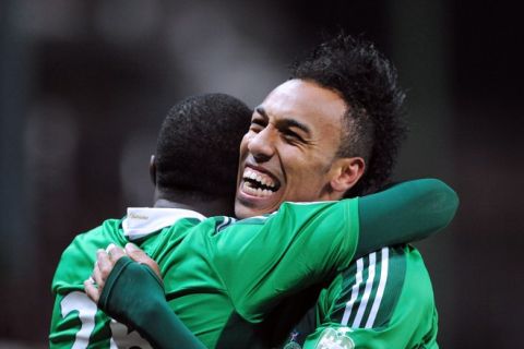 Saint Etienne French forward  Pierre Emerick Aubameyang (R) is congratulated by a teammate after scoring a goal during the French L1 football match Saint-Etienne vs Lorient on February 22 ,  2012 at the Geoffroy-Guichard stadium in Saint-Etienne. 

AFP PHOTO PHILIPPE MERLE (Photo credit should read PHILIPPE MERLE/AFP/Getty Images)