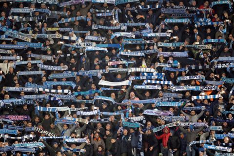 Napoli supporters hold up their scarves during the Champions League round of 16, second leg, soccer match between Napoli and Real Madrid at the San Paolo stadium in Naples, Italy, Tuesday March 7, 2017. (AP Photo/Andrew Medichini)