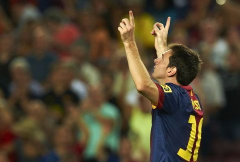 FC Barcelona's Lionel Messi, from Argentina, celebrates his goal during a Spanish La Liga soccer match against Real Sociedad at the Camp Nou stadium in Barcelona, Spain, Sunday, Aug. 19, 2012. (AP Photo/Siu Wu)