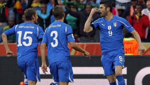 Italy's Vincenzo Iaquinta, right, celebrates with teammates Claudio Marchisio, left, and Domenico Criscito after scoring during the World Cup group F soccer match between Italy and New Zealand at Mbombela Stadium in Nelspruit, South Africa, Sunday, June 20, 2010.  (AP Photo/Bernat Armangue)