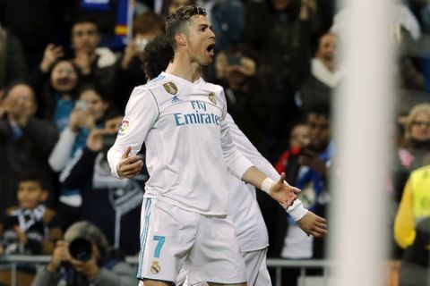 Real Madrid's Cristiano Ronaldo celebrates after scoring during a Spanish La Liga soccer match between Real Madrid and Girona at the Santiago Bernabeu stadium in Madrid, Spain, Sunday, March 18, 2018. (AP Photo/Paul White)