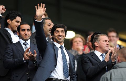 Manchester City owner Sheikh Mansour bin Zayed bin Sultan Al Nahyan waves from the stands prior to kick-off