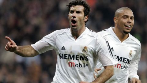 Real Madrids Portuguese player Luis Figo, left, celebrates with Brazilian team mate Ronaldo after Figo scored against Mallorca with a penalty kick during a Spanish league soccer match at the Bernabeu stadium in Madrid Sunday Jan. 23, 2005. (AP Photo/Paul White) **  EFE OUT  **