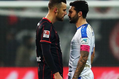FRANKFURT AM MAIN, GERMANY - DECEMBER 06:  Haris Seferovic (L) of Frankfurt and Aytac Sulu of Darmstadt stand face to face during the Bundesliga match between Eintracht Frankfurt and SV Darmstadt 98 at Commerzbank-Arena on December 6, 2015 in Frankfurt am Main, Germany.  (Photo by Alex Grimm/Bongarts/Getty Images)