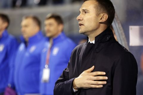 Ukraine's head coach Andriy Shevchenko sings the national anthem ahead of the World Cup Group I qualifying soccer match between Croatia and Ukraine, at Maksimir stadium in Zagreb, Croatia, Friday, March 24, 2017. (AP Photo/Darko Bandic)