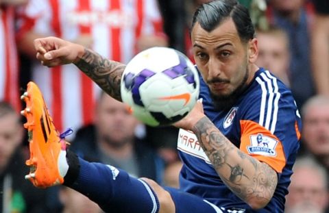Fulham's Kostas Mitroglou during the English Premier League soccer match between Stoke City and Fulham at the Britannia Stadium in Stoke On Trent, England, Saturday, May 3, 2014. (AP Photo/Rui Vieira)
