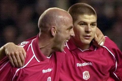 Liverpool's Gary McAllister, left, celebrates with teammate  Steven Gerrard after McAllister scored a goal against Barcelona during a UEFA Cup semi final, 2nd leg, soccer match in Liverpool Thursday, April 19, 2001. (AP Photo/Denis Doyle)