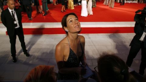 Jury member Christiana Capotondi looks up as she arrives on the red carpet during the 74th edition of the Venice Film Festival, in Venice, Italy, Monday, Sept. 4, 2017. (AP Photo/Domenico Stinellis)
